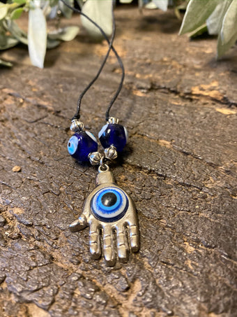 Protecting against negativity: evil eye pendant necklace, Rudraksha Mala