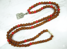  Enhance your spiritual practice with this handcrafted prayer mala, thoughtfully made with coral and Rudraksha beads and featuring a Ganesha pendant to inspire positivity and focus. Perfect for meditation, chanting, or yoga, this mala combines traditional craftsmanship with sacred symbolism.