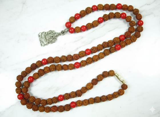 Enhance your spiritual practice with this handcrafted prayer mala, thoughtfully made with coral and Rudraksha beads and featuring a Ganesha pendant to inspire positivity and focus. Perfect for meditation, chanting, or yoga, this mala combines traditional craftsmanship with sacred symbolism.
