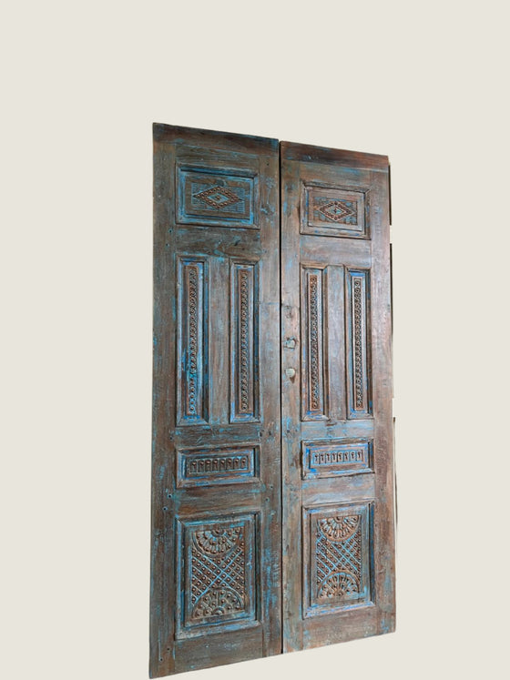 Vintage wooden doors with intricate carvings 