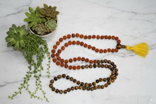  Discover Rudraksha Tiger Eye Beads Japa Mala, hand-knotted for strength, balance, and spiritual practice. Ideal for yoga, meditation, and healing.