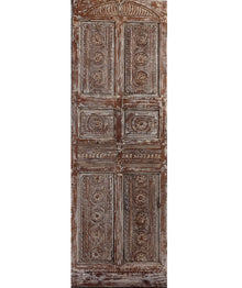 A beautifully carved vintage bedroom door made from reclaimed wood with floral detailing. Perfect as a sliding barn door or a unique statement entryway.