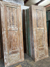whitewashed carved door
