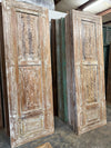 whitewashed carved door