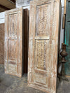 whitewashed carved door