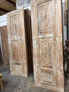 whitewashed carved door