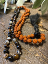Protecting against negativity: evil eye pendant necklace, Rudraksha Mala